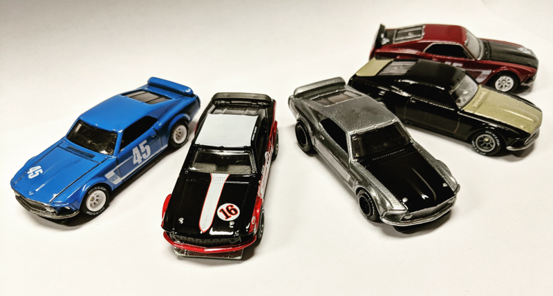 Clockwise from right: #45 Reventlow/Pettey Racing Boss 302 (VDH Customs), #11 Smokey Yunick Boss 302 (VDH Customs), zamac Boss 302 (@socaldiecast962 custom), Parnelli Jones Boss 302 (Hot Wheels), #45 Dan Gurney tribute Boss 302 (VDH Customs)